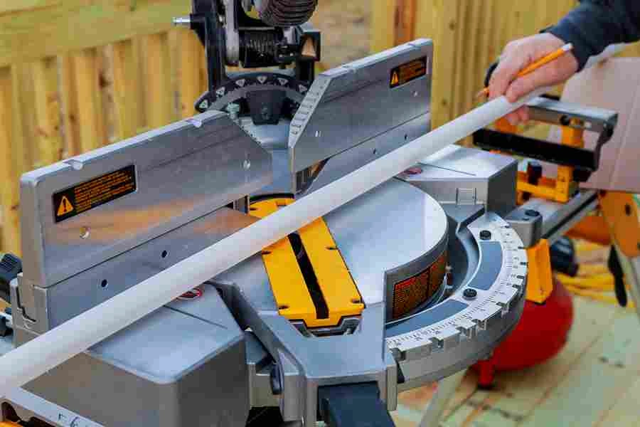 https://ukmech.com/wp-content/uploads/2024/10/closeup-mature-man-sawing-lumber-with-sliding-compound-miter-saw-outdoors_11zon.webp