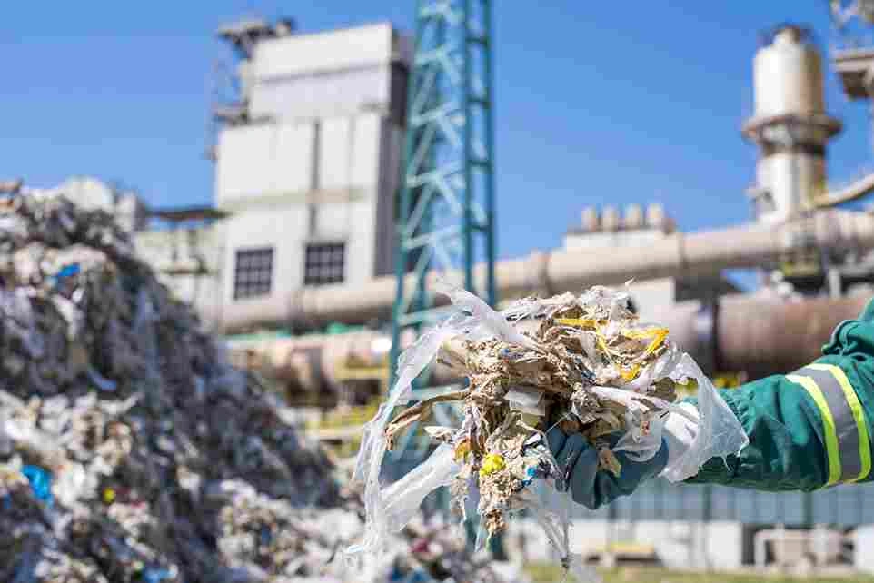 selective-focus-shot-person-wearing-gloves-holding-shredded-municipal-waste_11zon